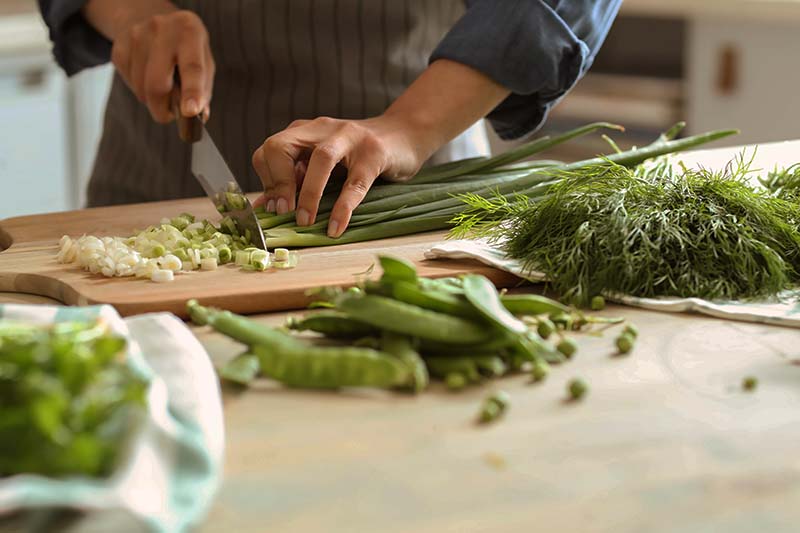 chopping herbs and vegetables for cooking