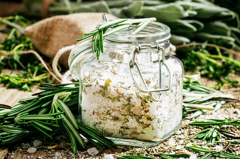 herb salt with dried herbs in a jar
