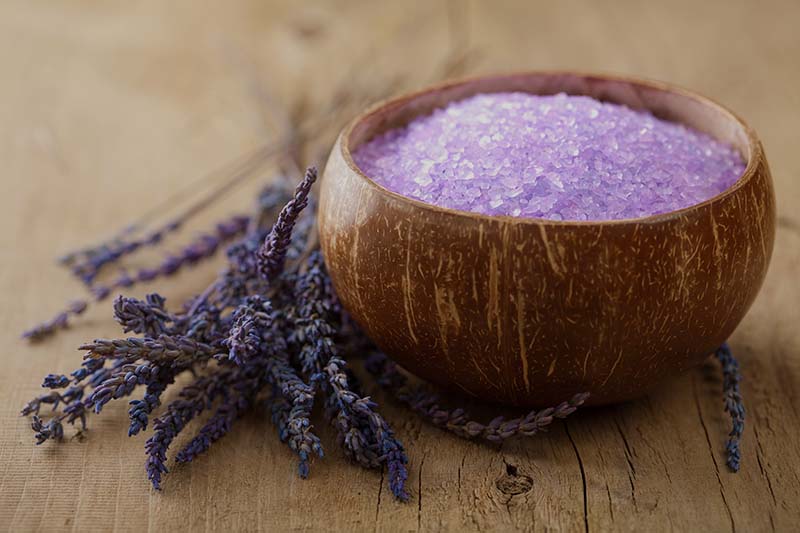 lavender scented herbal bath salts in a wooden bowl